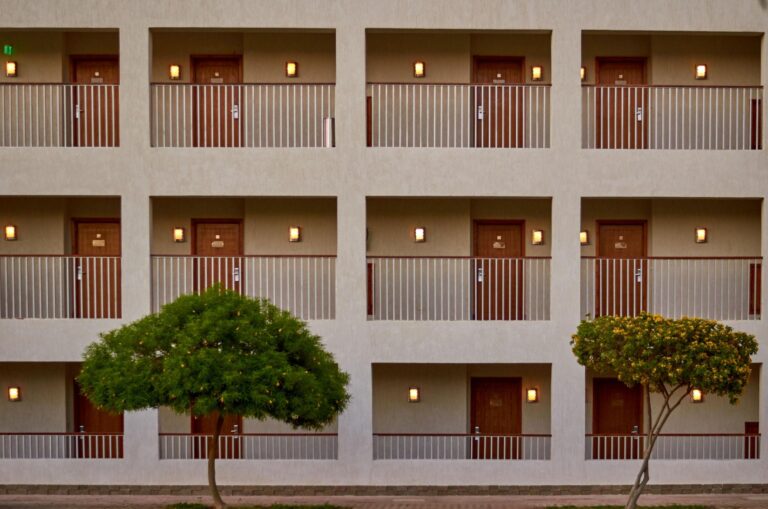 Boutique hotel exterior with glass facade 768x509
